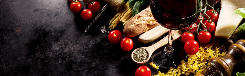Tasty fresh appetizing italian food ingredients on dark background. Ready to cook. Home Italian Healthy Food Cooking Concept.